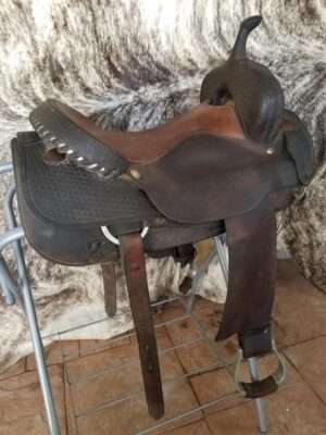 Coat cutting saddle with a Buster Welch tree,heavy duty rigging and oxbow stirrup
